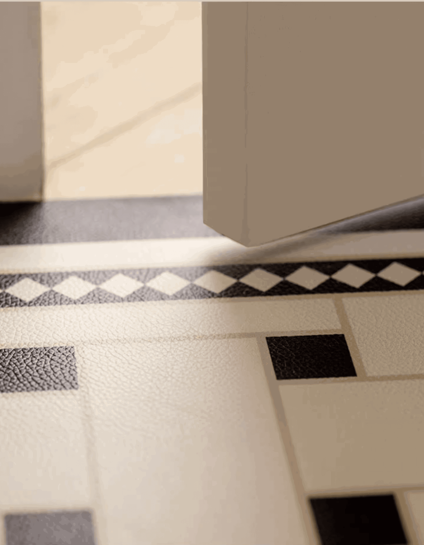 Zuumat checkerboard door mat-enterway with black and white geometric pattern at an open doorway