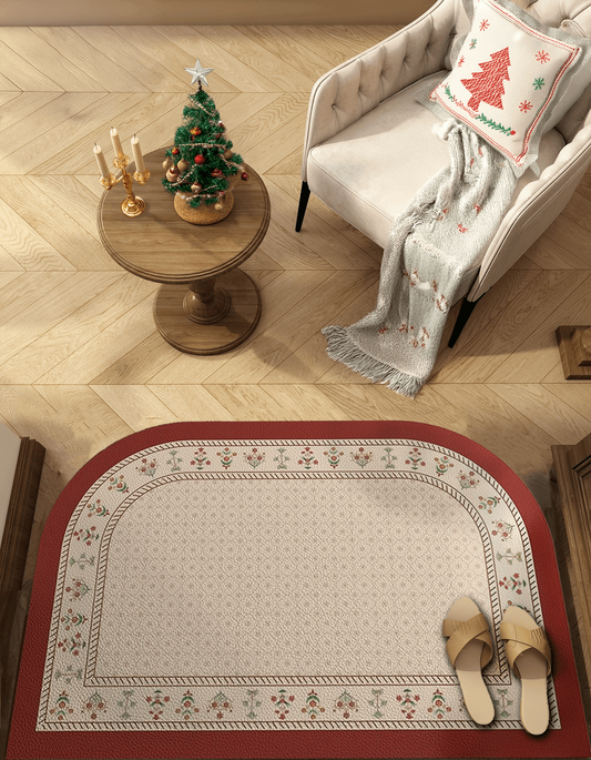 Zuumat red border floral floor mat placed on wooden floor near armchair and small table